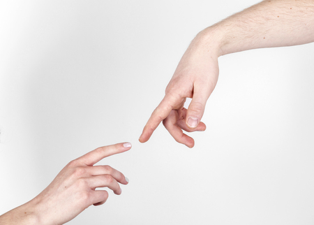 Fingers of Two People Nearly Touching - Isolatedの写真素材