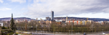 JENA, GERMANY -JAN 10, 2016: Skyline of Jena in Thuringia, Germany under cloudy sky witn new intershop skyscraperのeditorial素材
