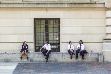 NEW YORK, USA - JULY 11, 2010: workers at Metropolitan museum have a break in the sun. They enjoy the good weather outside the metropolitan Museum.のeditorial素材