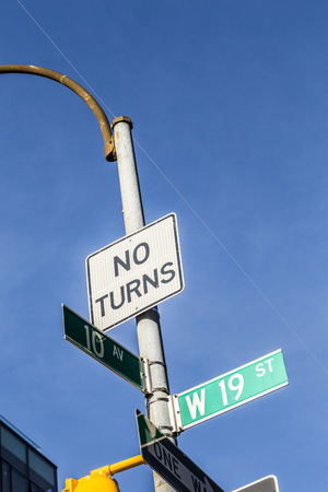 traffic sign and street name in New York under blue skyの写真素材