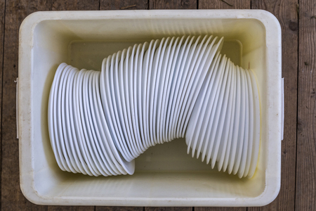 many white plates stapled in a boy