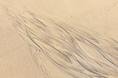 pattern type texture on the sand beach while low tide timeの写真素材