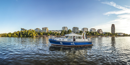 FRANKFURT, GERMANY - AUG 17, 2016: people enjoy the open air festival from the river with the HR synphony orchestra guarded by police.のeditorial素材