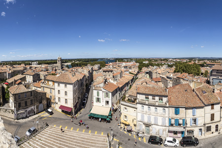 ARLES, FRANCE - AUG 21, 2016: panoramic view with people from famous arena in Arles to old town, France.のeditorial素材