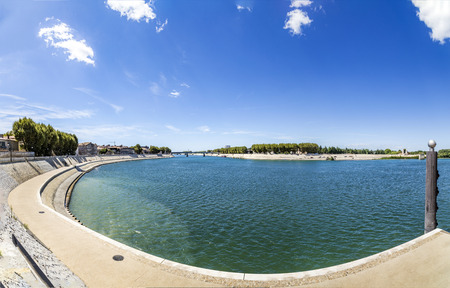 river Rhone in Arles under blue skyの写真素材