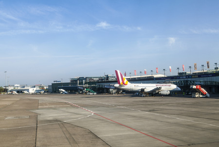 BREMEN, GERMANY - MAY 12, 2016: german wings aircraft operates from Bremen airport and parks for boarding at the gate.のeditorial素材