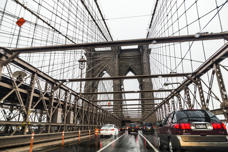 NEW YORK, USA - OCT 28, 2015: using the Brooklin Bridge to cross the river by car direction Brooklyn in heavy rain in New York on the Brooklyn queens express highway.のeditorial素材