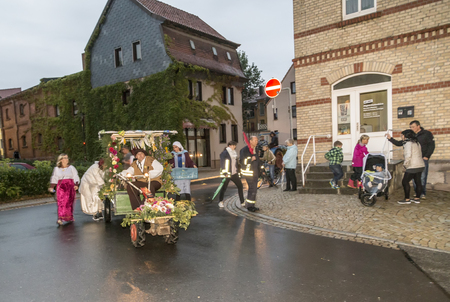 BAD FRANKENHAUSEN - SEP 17, 2016: people at the farmers procession to remember the farmer revolution in the medieval times in Bad Frankenhausen, Germany.のeditorial素材