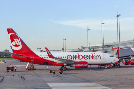 HAMBURG, GERMANY - SEP 28, 2011: air Berlin aircraft parks in front of new Terminal in Hamburg.のeditorial素材