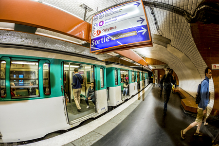 PARIS , FRANCE- JUNE 10, 2015: Tourists and locals on a subway train in Paris, France. More than 30 million people visit Paris annually.のeditorial素材