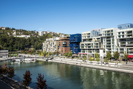 LYON, FRANCE - OCT 4, 2016: famous Confluence District with people in Lyon, France with river. The...