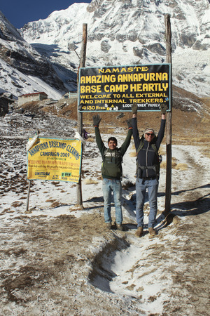 ANNAPURNA BASE CAMP, NEPAL, DEC 29, 2013: people enjoy the entrance to  Mount Annapurna  base camp, round Annapurna circuit trekking trail, Nepalのeditorial素材