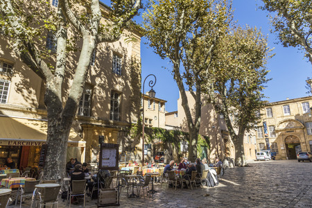 AIX EN PROVENCE, FRANCE - OCT 19, 2016: people enjoy sitting in a  typical outdoor bar at place de l hotel de la ville in Aix en Provence.のeditorial素材