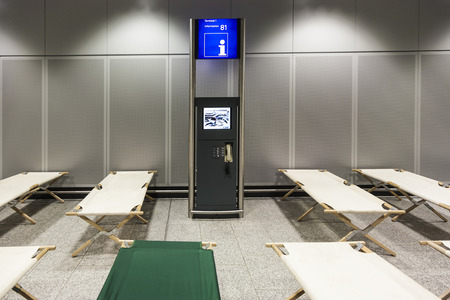 FRANKFURT, GERMANY - JAN 11, 2010:  camp beds are standing row by row in the airport terminal in Frankfurt in case a lot of passengers have to stay overnight.のeditorial素材