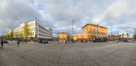MUNICH, GERMANY - NOV 12, 2016: skyline of Munich Pasing train station and street with people. Munich Pasing train station is the third biggest station in Munich and was build in 1847.のeditorial素材