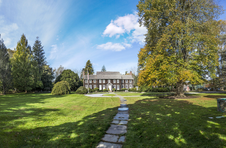 EAST HAMPTON, USA - OCT 27, 2015: view to old victorian buildings and the public park in East Hampton on a sunny day.のeditorial素材