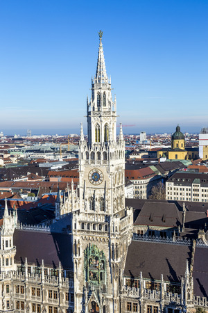 facade of new munich town hall under blue skyの写真素材