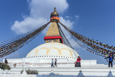 KATHMANDU, NEPAL - MAR 15, 2014: unidentified pilgrims visit the Buddhist religious centre Boudhanath Stupa in Kathmandu, Nepal. Boudhanath is a UNESCO world heritage siteのeditorial素材