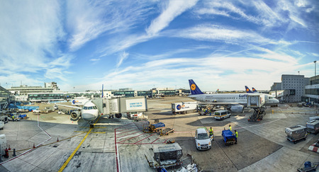 FRANKFURT, GERMANY - MAY 18, 2015:  aircrafts park at terminal 1 at the Airport in daytime in Frankfurt, Germany. In 2012, Frankfurt handled 57.5 million passengers.のeditorial素材
