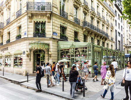 PARIS, FRANCE - JUNE 12, 2015: people in front of LADUREE shop at champs elysees. It is the most famous shopping mile in France.のeditorial素材