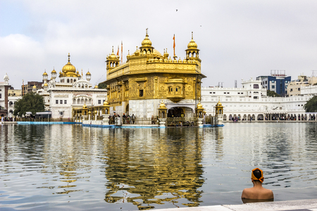 AMRITSAR, INDIA - FEB 24, 2013: people visit the   Harimandir Sahib at the Golden temple complex, Amritsar - Indiaのeditorial素材