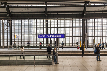 BERLIN, GERMANY - MAY 3, 2016: Railstation Berlin Friedrichstrasse with people waiting for trainのeditorial素材