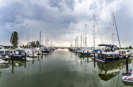 ZEMPIN, GERMANY - AUG 8, 2015: harbor at backwater in Zempin at the island of Usedom, Germanyのeditorial素材