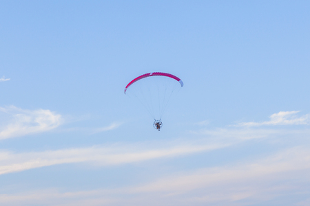 MIAMI, USA - JULY 26, 2010: Paraglider flying along the beach in Miami, USA. In the USA powered paragliding is minimally regulated and requires no licence.のeditorial素材