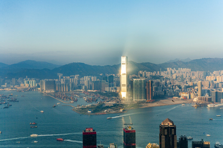 VICTORIA, HONG KONG - JAN 9, 2010: Hong Kong city view to Kowloon from Victoria peak with reflection of skyscrapers.のeditorial素材
