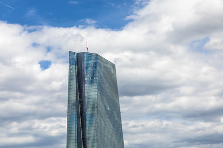 FRANKFURT, GERMANY - JULY 29, 2017: view to ECB building with reflections of blue sky and clouds in facade . ECB was inaugurated in 2015 with demonstrations.  Actual head of ECB is Mario Draghi.のeditorial素材