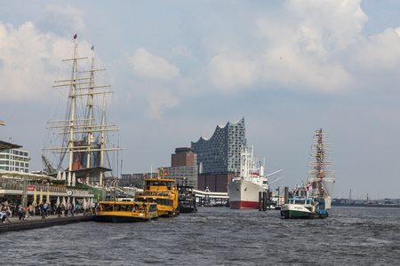 HAMBURG, GERMANY - AUG 2, 2017: view to harbor of Hamburg and famous Elb Philharmony. The Philharmony was inaugurated in 2017 and is the most expensive modern building in Hamburg.のeditorial素材