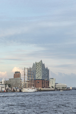 HAMBURG, GERMANY - AUG 2, 2017: view to harbor of Hamburg and famous Elb Philharmony. The Philharmony was inaugurated in 2017 and is the most expensive modern building in Hamburg.のeditorial素材