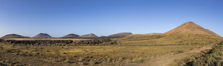 beautiful volcanos in Timanfaya national park near Mancha Blanca in morning lightの写真素材
