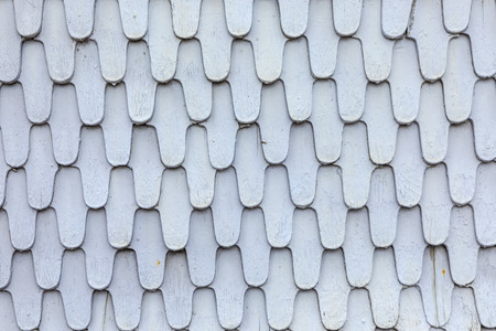 grey old wooden roof shingles give a harmonic backgroundの写真素材