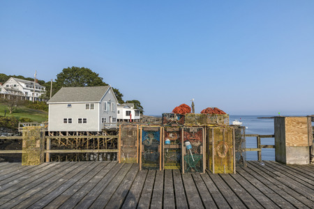 lobster cage at a pier in a fisher harbor in the New England state of Maineの写真素材