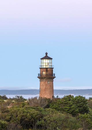 Gay Head Lighthouse and Gay Head cliffs of clay at the westernmost point of Martha's Vineyard in Aquinnah, Massachusetts, USA. This historic lighthouse was built in 1856.の写真素材