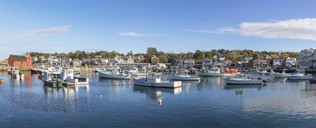 ROCKPORT, USA - SEP 28, 2017: old harbor in Rockport with motor ships under blue skyのeditorial素材