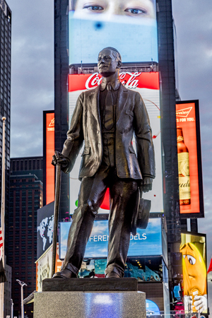 NEW YORK, USA  OCT 4, 2017:  neon advertising of News, brands and theaters at times square with statue of George m. Cohan in early morning. Times square is a symbol for New York life and amusement.のeditorial素材