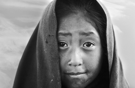 TAQUILE, PERU - APR 4, 1986: portrait of young farmer girl in early morning with rags at the peruan island of Taquile.のeditorial素材