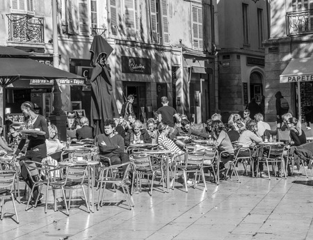 AIX EN PROVENCE, FRANCE - OCT 19, 2016: people enjoy a warm summer day by sitting and meeting in an outdoor bar in Aix en Provence, France.のeditorial素材