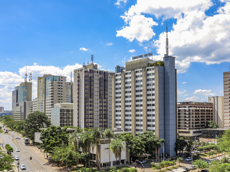 BRASILIA, BRAZIL - OCT 26, 2013: view to modern buildings with street crossing in Brasilia, Brazil....