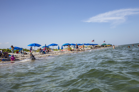 MIAMI, USA - AUG 22, 2014: People relax at the Crandon Park beach in Miami, USA. The park is more than 800 acres in size, and has two miles  of beach on the Atlantic Ocean side.のeditorial素材