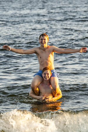 DAUPHIN ISLAND, USA - JULY 17, 2013: people enjoy the beautiful beach in late afternoon  at Dauphin Island, USA.のeditorial素材