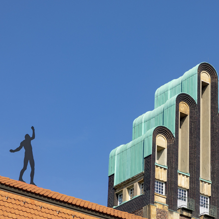 Mathildenhoehe with wedding tower and man on roof in Darmstadtのeditorial素材