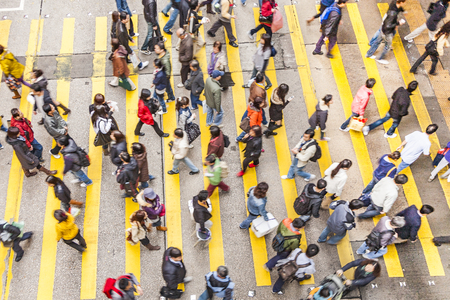 HONG KONG, CHINA - JAN 7, 2010: aerial view of people crossing a street at a pedestrian crossing.のeditorial素材