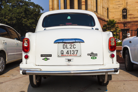 NEW DELHI , INDIA - NOV 17, 2011: Official Hindustan Ambassador cars park outside North Block, Secretariat Building in Delhi, India. The production started in 1958 on base of the Morris model.のeditorial素材