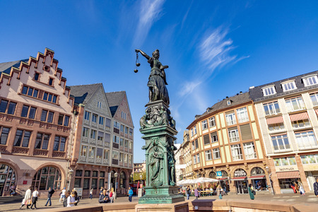FRANKFURT, GERMANY - OCT 15, 2018: people visit the roemer place  with fountain of lady justice in Frankfurt at the roemer.のeditorial素材