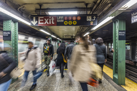 NEW YORK, USA - OCT 20, 2015: People wait at subway station Atlantic Avenue in New York. With 1.75 billion annual ridership, NYC Subway is the 7th busiest metro system in the world.のeditorial素材