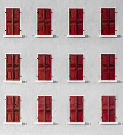 wooden shutter in intensive color with white wall gives a harmonic background