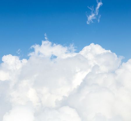 Sky background with the fluffy white cloudsの写真素材